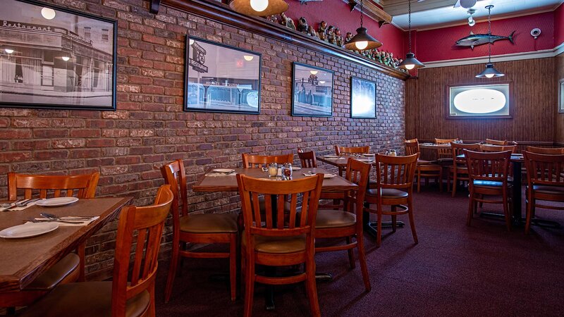 Dining room with view of five set tables