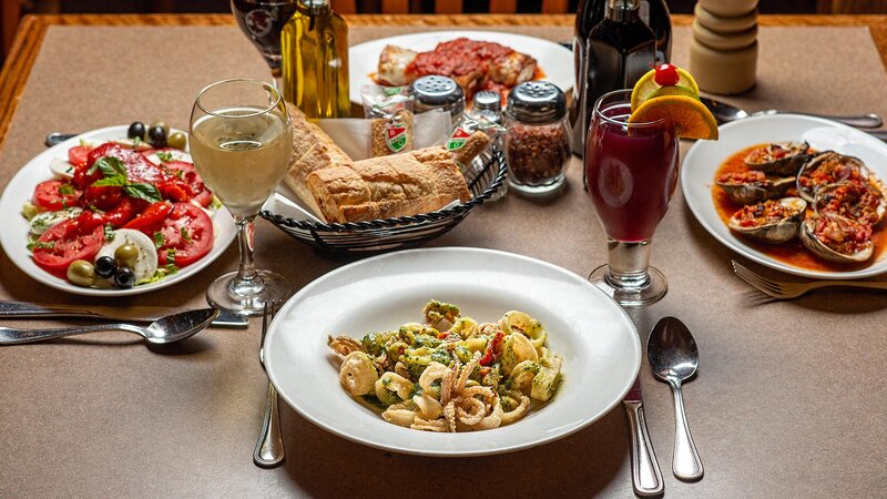 Several appetizers with focus on calamari appetizer