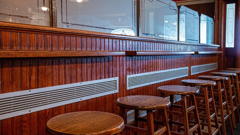 Bar seating area with many bar stools